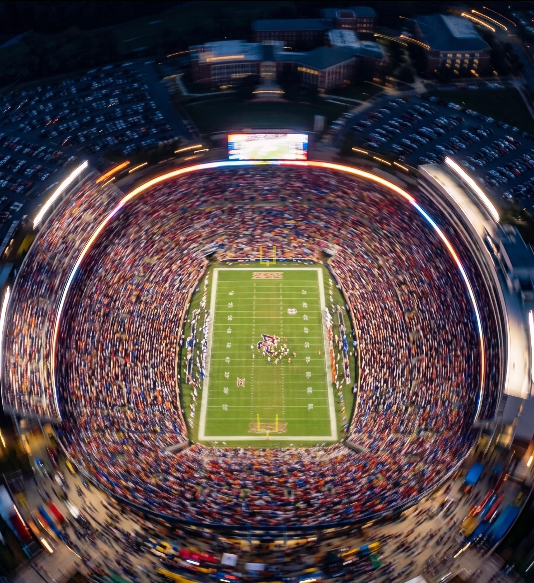 Fans filling the stadium under the lights